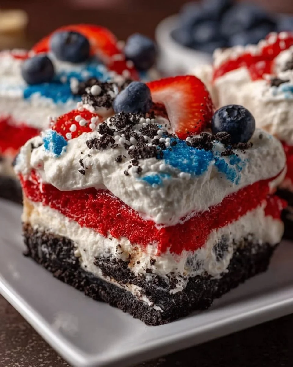Delicious Patriotic Oreo Lasagna dessert with layers of cream and cookies